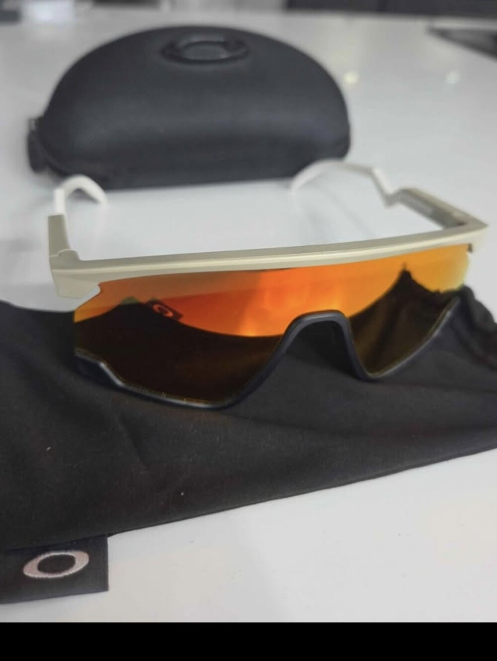 Oakley White Frame Sunglasses with Orange Mirror Lens